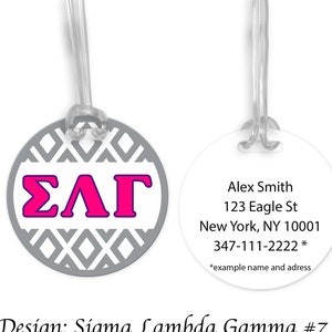 May include: A white luggage tag with a gray and white geometric pattern and the letters "ΣΛΓ" in pink. The back of the tag has the text "Alex Smith, 123 Eagle St, New York, NY 10001, 347-111-2222 *example name and address". The tag is designed for Sigma Lambda Gamma sorority.