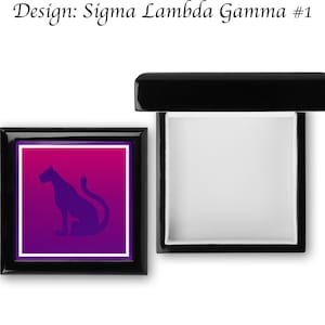 May include: Black wooden box with a hinged lid. The lid features a purple and pink gradient background with a black silhouette of a panther. The text "Design: Sigma Lambda Gamma #1" is printed above the box.