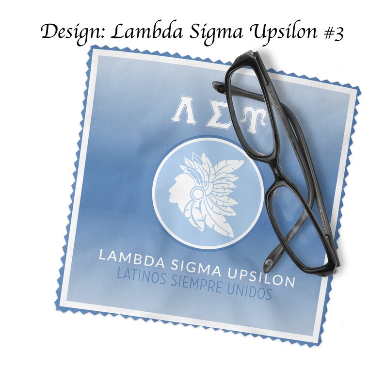 May include: A blue and white design with the text "Lambda Sigma Upsilon Latinos Siempre Unidos" and the Greek letters "&Lambda;&Sigma;&Upsilon;" on a blue background. A pair of black spectacles is on top of the design.