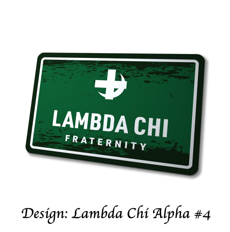 May include: A rectangular green sign with white text and a white cross symbol. The sign reads "LAMBDA CHI FRATERNITY" in bold white letters. The design is labeled "Design: Lambda Chi Alpha #4" in a cursive font.