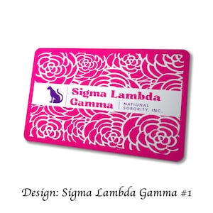 May include: A rectangular, hot pink card with a white floral pattern. The card features the text "Sigma Lambda Gamma" and a purple silhouette of a cat. The words "National Sorority, Inc." are also present.