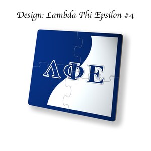 May include: Blue and white jigsaw puzzle with the Greek letters Lambda Phi Epsilon in blue on a white background. The letters are in a curved line.