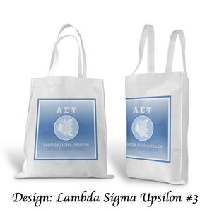 Op de afbeelding: Een set van drie keramische mokken met een gespikkelde, matte afwerking. De mokken zijn in crème, lichtgrijs en donkergrijs. Elke mok heeft een eenvoudig, minimalistisch ontwerp.