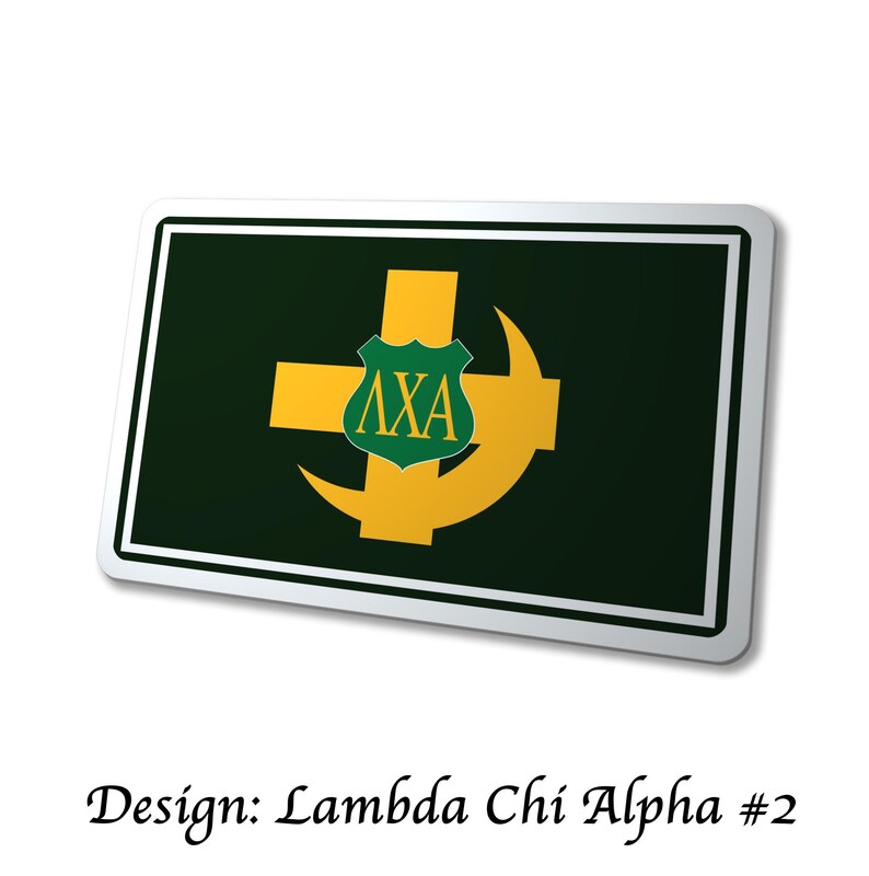 May include: A rectangular sign with a dark green background and a white border. The sign features a gold cross and crescent design, with a green shield containing the Greek letters &Lambda;XA. The text "Design: Lambda Chi Alpha #2" is at the bottom.