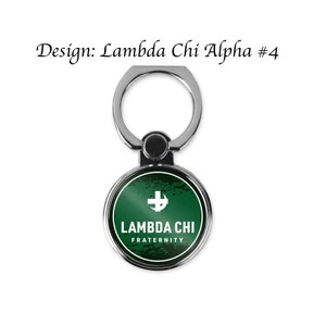 May include: A silver phone ring holder with a green circle featuring a white cross and the text "Lambda Chi Fraternity".