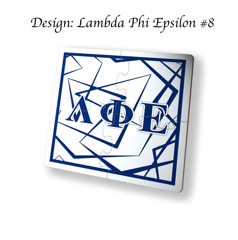 May include: A white jigsaw puzzle with a blue border and a blue Greek letter design. The letters are Lambda, Phi, and Epsilon. The design is number 8.
