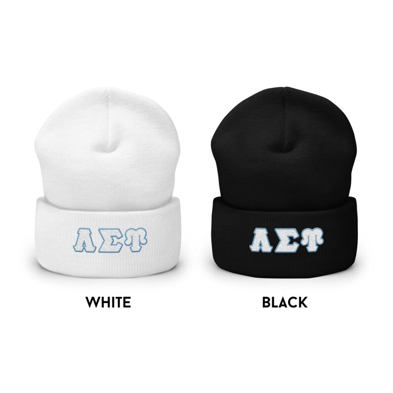 May include: Two knit beanies, one white and one black, with the Greek letters "A&Sigma;&Gamma;" embroidered in blue on the front.