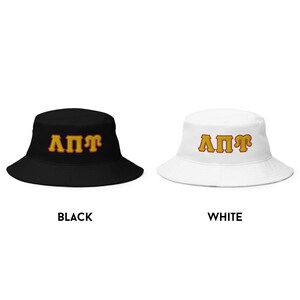 May include: Two bucket hats, one black and one white, with the letters "&Lambda;&Pi;&Gamma;" in yellow with red outlines.