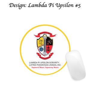 May include: A white computer mouse beside a round yellow sticker with a sorority crest. The crest features a shield with a jaguar, a pillar, and scales. Text includes "Lambda Pi Upsilon Sorority" and "Empowered Women, Empowering Women."