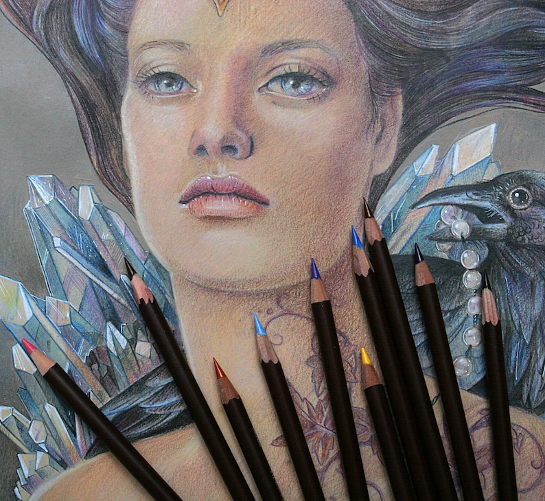 May include: A woman with long, dark hair is drawn in pencil. She has a crown on her head and is wearing a necklace of pearls. A raven is perched on her shoulder. The woman is surrounded by crystals and colored pencils.