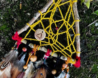 Handmade boho dream catcher fire element spirituality while hanging