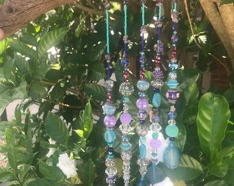 Driftwood suncatcher with agate and amethyst crystals and beads and baubles