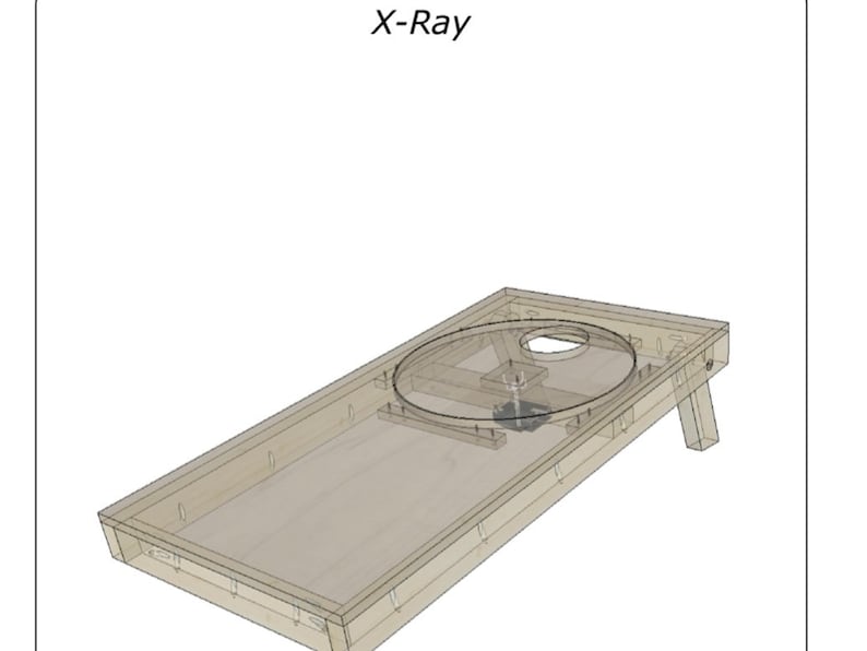 May include: X-Ray image of a wooden cornhole game board with a clear plastic disc in the center. The board has a wooden frame and two legs.