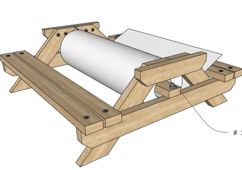 May include: A wooden table with a roll of paper on top. The table is made of unfinished wood and has a simple design. The paper roll is white and is being pulled off the table.