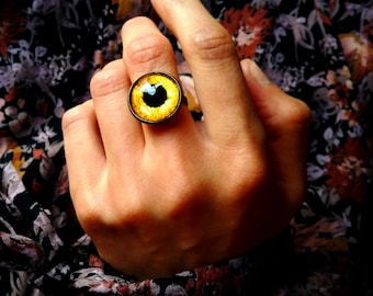 Gele glazen oogring, verstelbare bronzen band, boze oog talisman