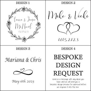 May include: Four design options for custom engraving. Design 1 features names and a date within a floral wreath. Design 2 includes names and intertwined hearts with a date. Design 3 shows names, a heart symbol, and a date. Design 4 offers a bespoke design request.