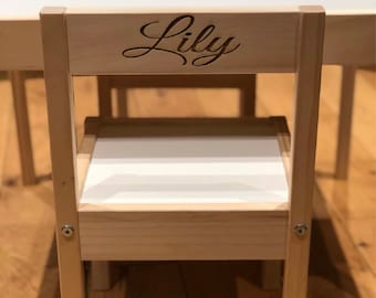 Personalised custom wood kids table and chairs engraved for children playtime.