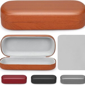 May include: A brown, wood-grain patterned eyeglasses case, open to reveal a gray interior. The case is rectangular with rounded edges. Below are three additional cases in red, black, and gray.