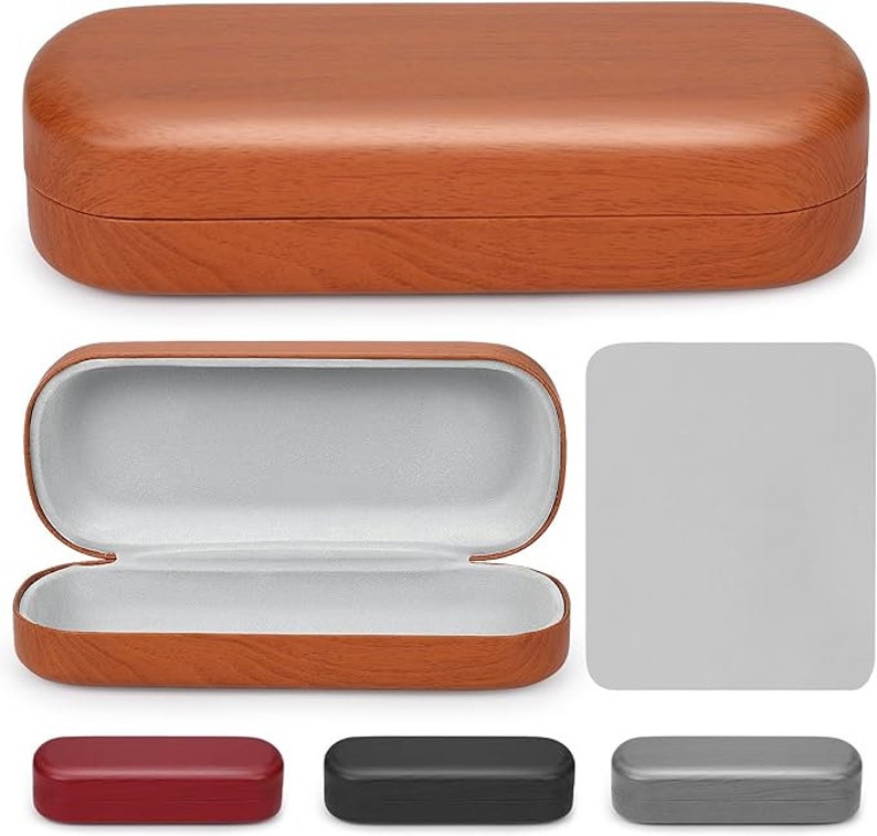 May include: A brown, wood-grain patterned eyeglasses case, open to reveal a gray interior. The case is rectangular with rounded edges. Below are three additional cases in red, black, and gray.