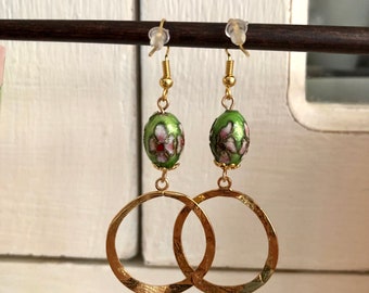 Pretty earrings with 24k fine gold hooks, green beads with pink, white and red flowers and round connectors.