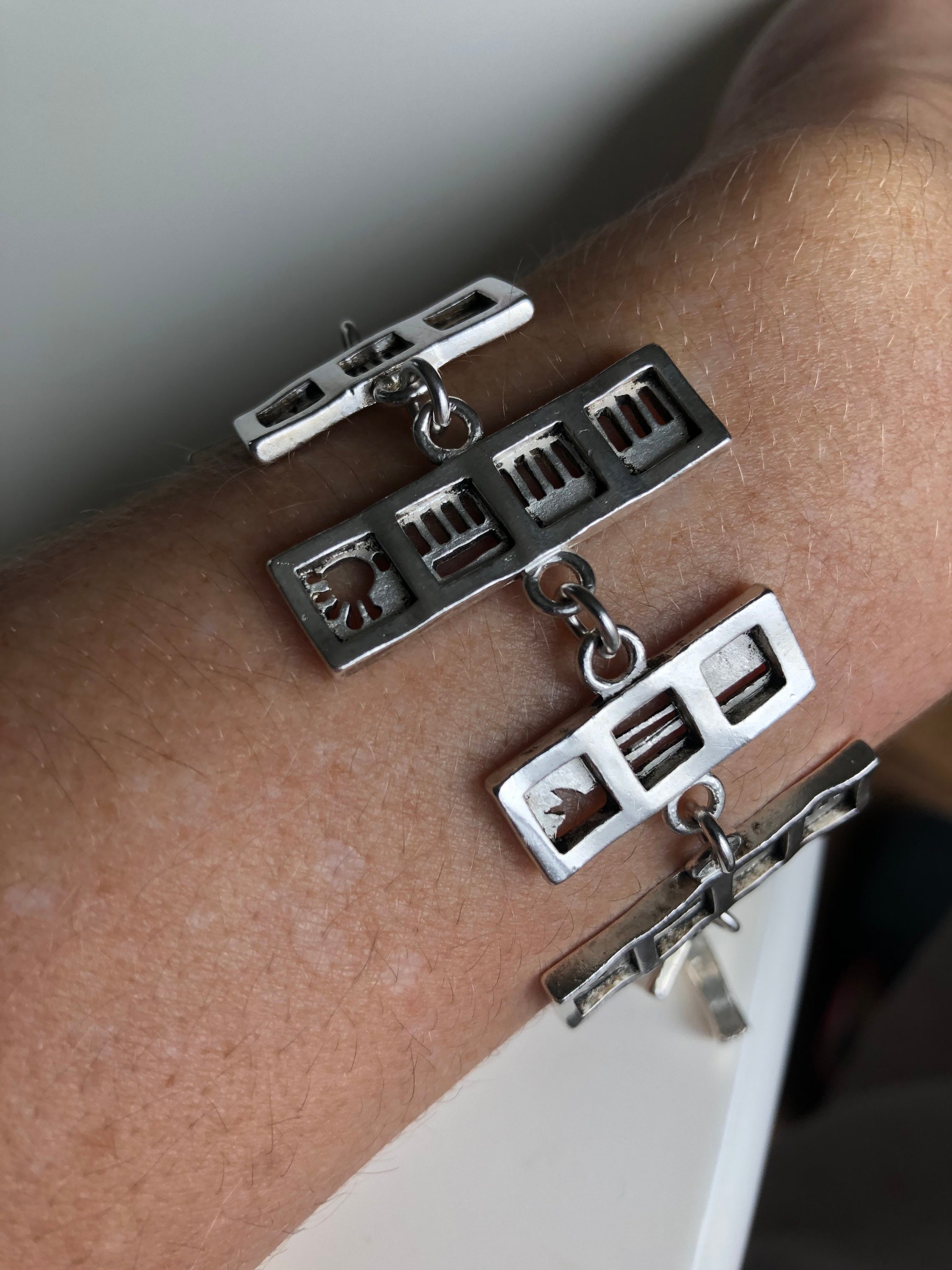 Rare: superb bracelet from the famous French brand Biche de Bere. Reversible silver bracelet with characters, large silver bracelet