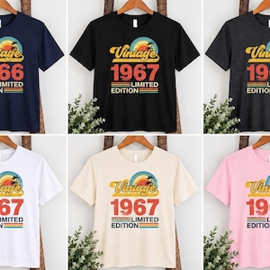May include: A collection of six short-sleeve t-shirts in navy, black, charcoal, white, cream, and light pink. Each shirt features a graphic print with a sunset, palm tree, and the text Vintage 1966 or 1967 Limited Edition in retro colors.