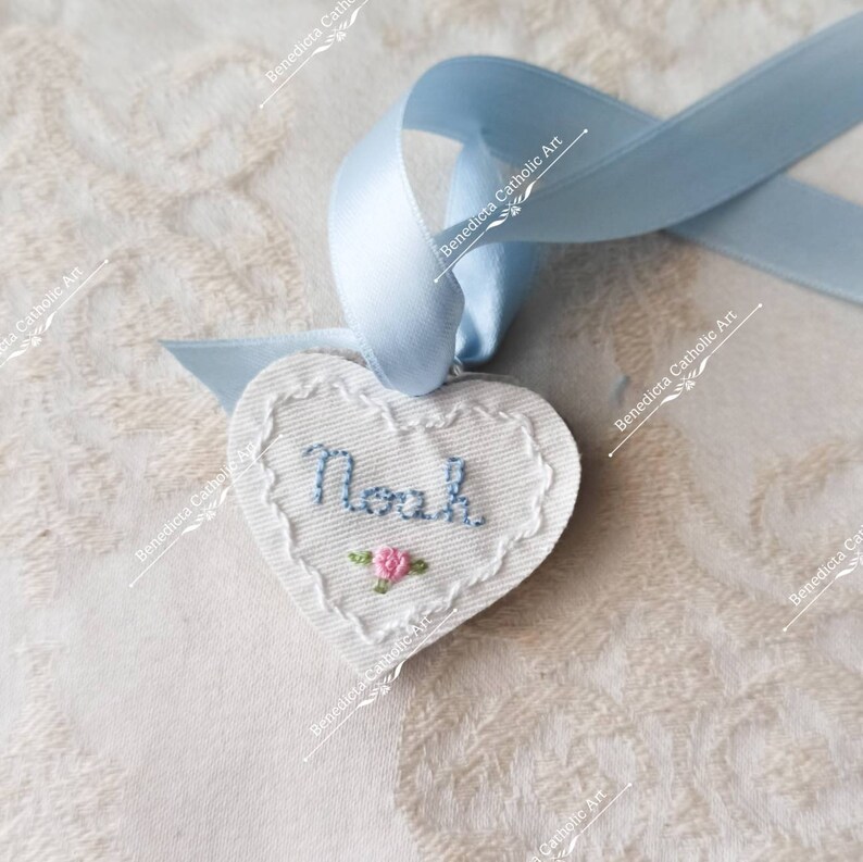 Protection for babies. Little crib medal hand embroidered