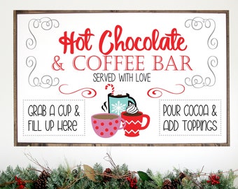 May include: A white sign with a brown wooden frame, advertising a hot chocolate and coffee bar. The sign features the text "Hot Chocolate & Coffee Bar" in red lettering, with the words "Served with Love" underneath. The sign also includes illustrations of mugs of hot chocolate and coffee, along with the text "Grab a cup & fill up here" and "Pour cocoa & add toppings."