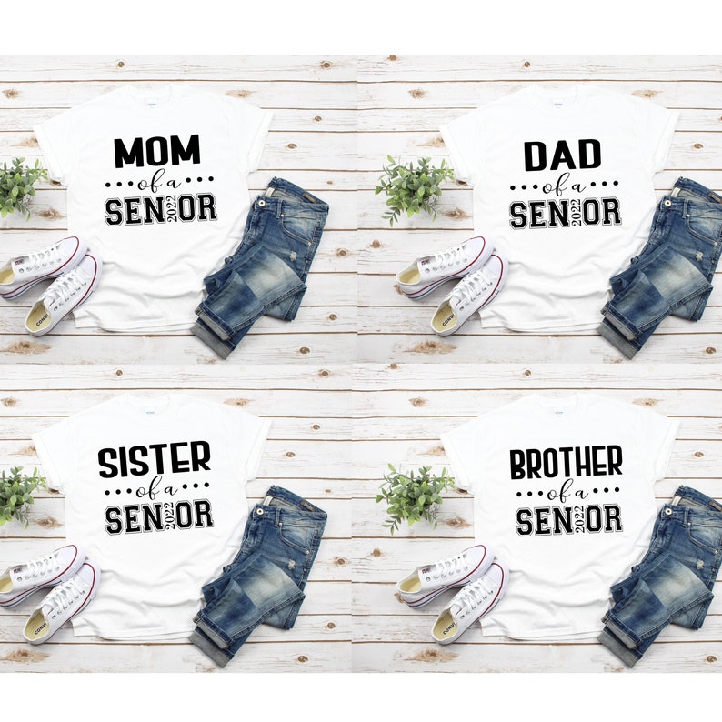 May include: Four white t-shirts with black text. The shirts say "Mom of a Senior 2023", "Dad of a Senior 2023", "Sister of a Senior 2023", and "Brother of a Senior 2023".