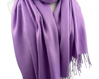 May include: A soft, lilac-colored scarf with fringed edges. The scarf is made of a lightweight material and is perfect for adding a touch of color to any outfit.