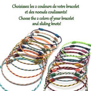 以下が含まれることがあります： スライドノット付きのカラフルな編み込みブレスレットのコレクション。ブレスレットは、青、緑、赤、オレンジ、白など、さまざまな色があります。画像内のテキストは「ブレスレットとスライドノットの2色をお選びください！」と書かれています。