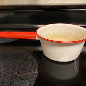 Vintage Enamel White and Red Sauce Pan, White enamel sauce pan with red trim and red handle, vintage enamel pan
