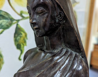 Bronze sculpture of woman wearing a sari on top of lotus marble pedestal, looking down in meditation. Vintage, large and heavy.