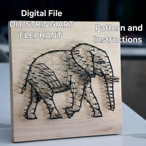 May include: Wooden square with a black string art elephant design. The text "Digital File DIY String Art Elephant Pattern and Instructions" is displayed at the top. The elephant is depicted walking, with its trunk and tusks visible.