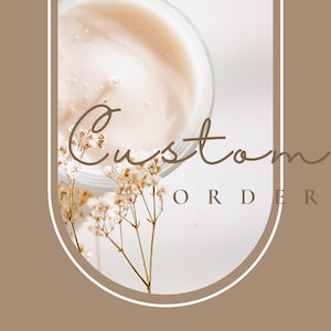 May include: A white background with a glass jar filled with a light brown liquid. The jar is partially obscured by a sprig of white flowers. The text "Custom Order" is written in brown cursive script.