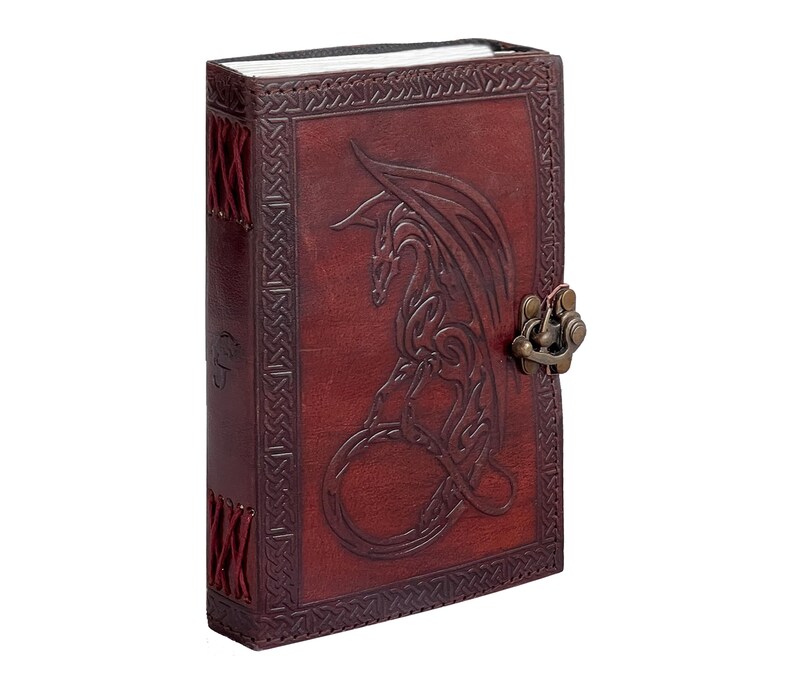 Handcrafted leather-bound journal Vintage Guest Book spell book, book of shadow, grimoire showing Coptic binding naturally tan leather. The book stands tall, no bleed through high quality handmade paper use as sketchbook or photo album.