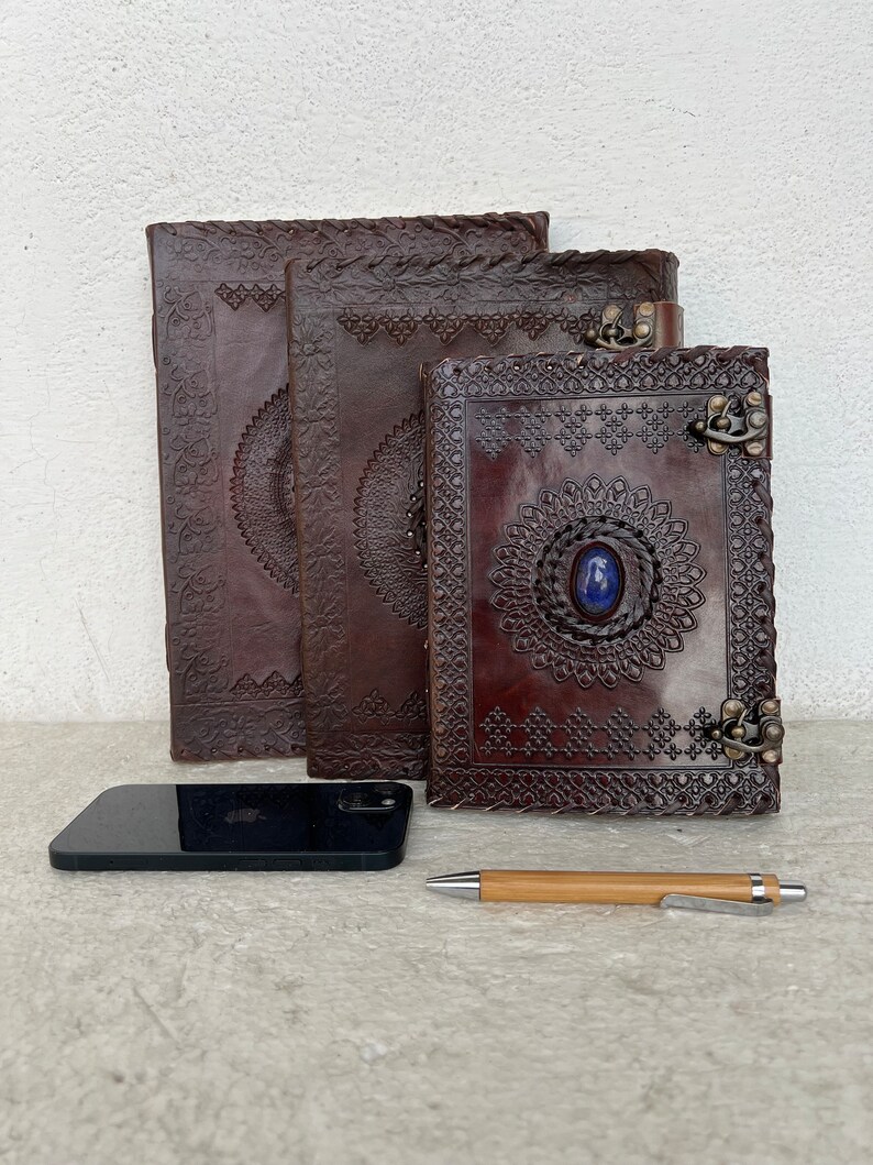 Showcase the journal size and portability with a visual of it being compared. Gift, travelogue, artist, painter, writer, students. practical stylish minimalist bohemian vintage diary logbook antique personalised luxury  experience.