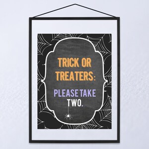 May include: Black and white printable sign with a chalkboard background and spiderweb design. The sign says "Trick or Treaters: Please Take Two."