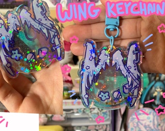 Glitter rainbow, wing shaker keychains , with 3 mini charms.