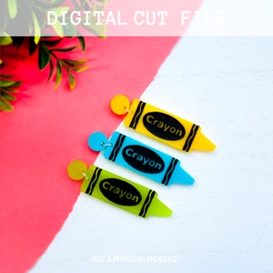 May include: Three digital cut files of crayon shaped earrings. The crayons are yellow, blue, and green. Each crayon has the word "Crayon" written on it in black.