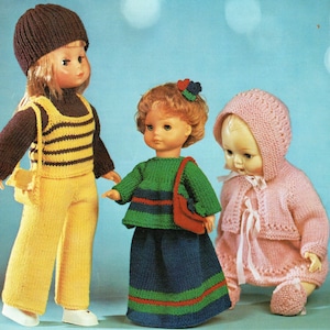 May include: A vintage knitting pattern booklet titled Lister Lee Target K521 featuring three dolls wearing hand-knitted outfits. The dolls are dressed in a yellow and brown striped set, a green and blue skirt set, and a pink hooded cardigan set.