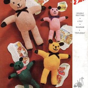May include: A vintage knitting pattern leaflet titled Emu 6228 featuring four hand-knitted teddy bears in beige, pink, yellow, and green. Each bear has black ears, paws, and embroidered facial features, with small ribbons tied around their necks.