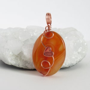 May include: A set of three ceramic mugs with a speckled, matte finish. The mugs are in shades of cream, light gray, and dark gray. Each mug has a simple, minimalist design and a rounded handle.