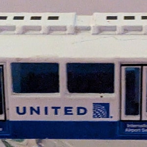 toy Realtoy United Airlines airport bus service shuttle vehicle ground support equipment GSE 1/64 diecast metal plastic b99
