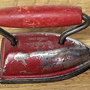 Vintage toy iron Lady Dover play clothes pretend red cast iron wood handle miniature not electric 3 1/2&quot; long weighs 6 ounces red b92