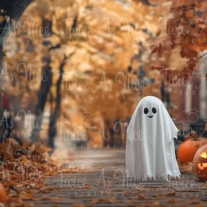 May include: A white ghost with a smiling face stands on a path in a forest with fall foliage.  There are pumpkins in the background.