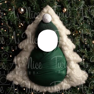 May include: A green and white Christmas tree-shaped newborn baby photo prop. The prop is made of soft fabric and has a white fluffy trim. The center of the prop has a white circle for a baby's face.