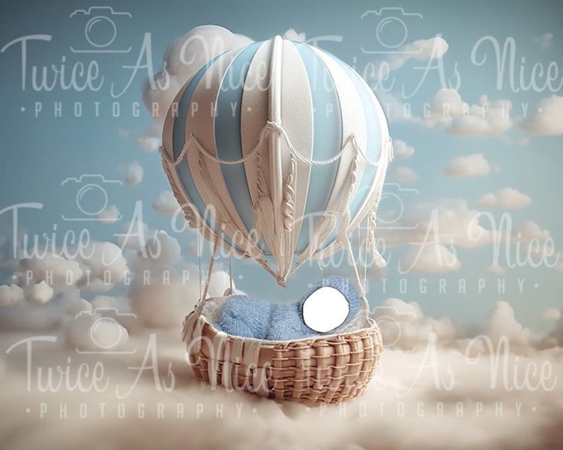 May include: A blue and white hot air balloon with a wicker basket, floating in a cloudy sky. The basket is filled with a blue blanket and a white pillow.