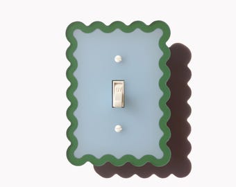 Placa de interruptor y tapas de enchufes con diseño ondulado