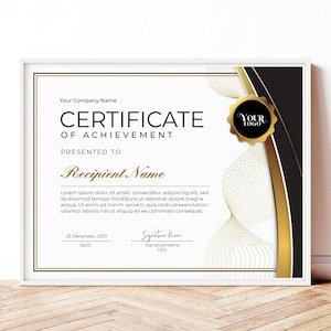 May include: A black and gold certificate of achievement with a gold seal and the text "Your Logo". The certificate is framed in white and has a white background with black and gold accents. The text on the certificate reads "Certificate of Achievement" and "Presented to Recipient Name".